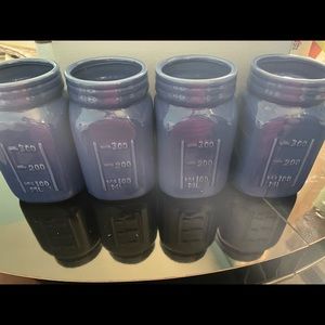 One (1) lot of 4 Royal blue ceramic jars.